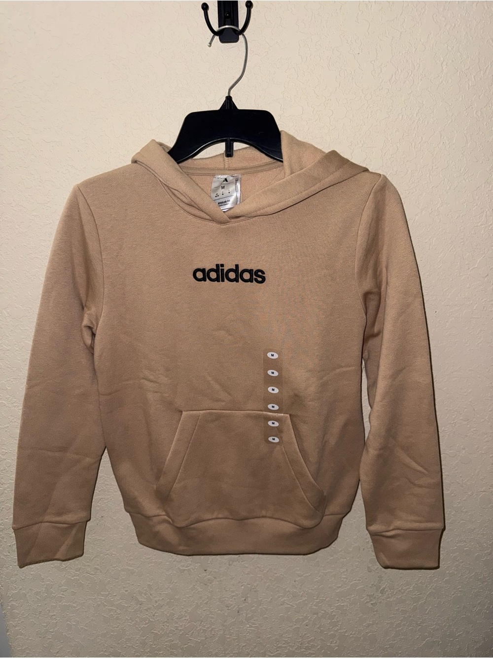 Boy’s beige Adidas hoodie with side pockets